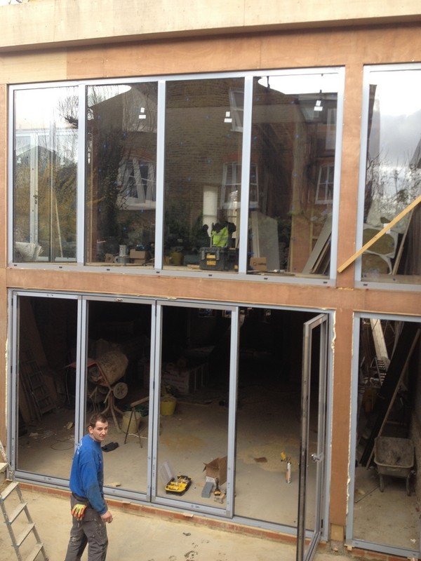 Aluminium bi-fold doors with two-storey glazing in Streatham Hill